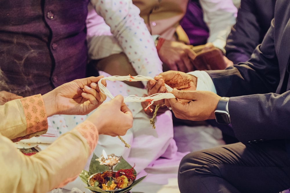 a group of people sitting next to each other