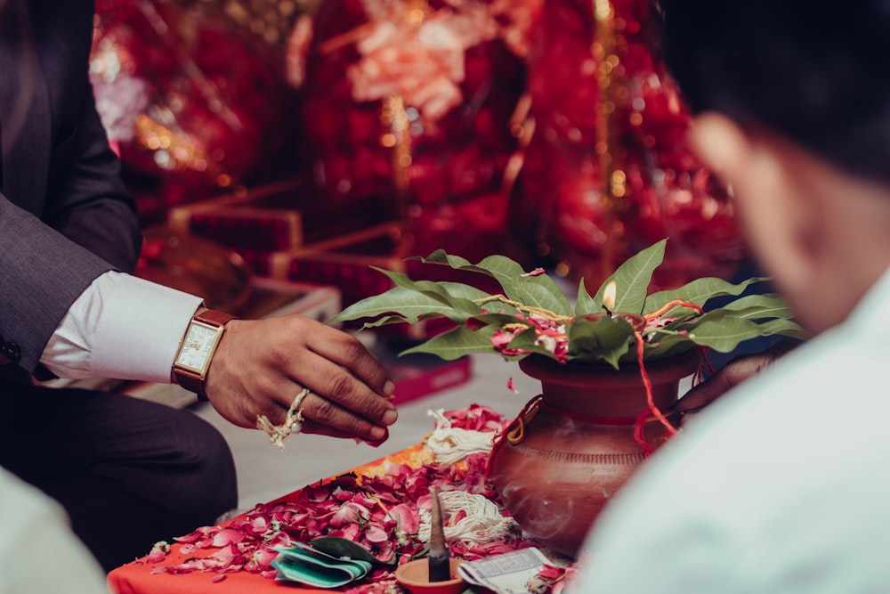 a man in a tuxedo places a ring on a woman's finger