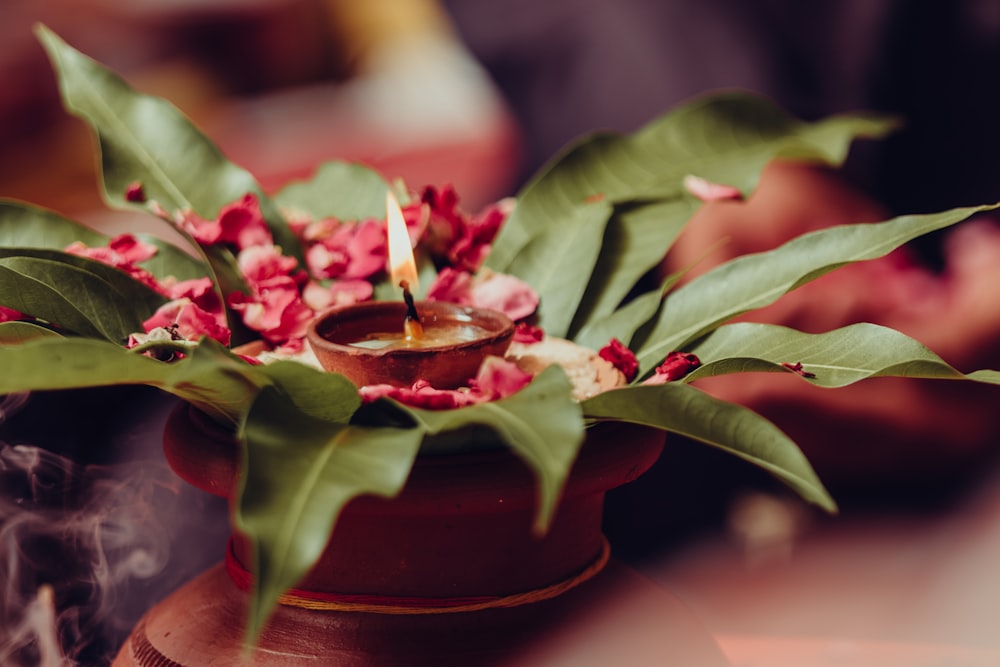 a candle that is sitting on top of a pot