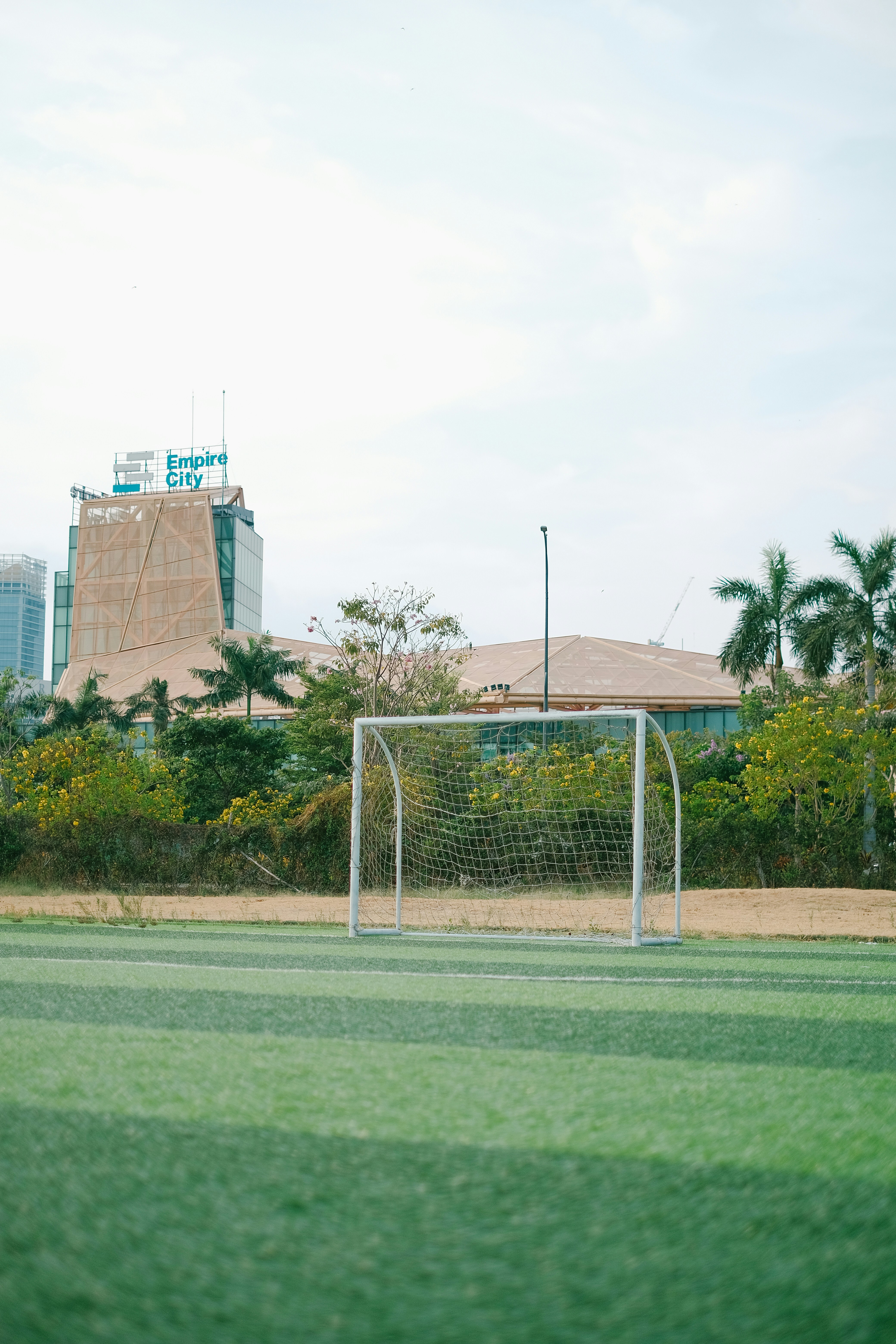 a soccer field with a soccer goal in the middle of it