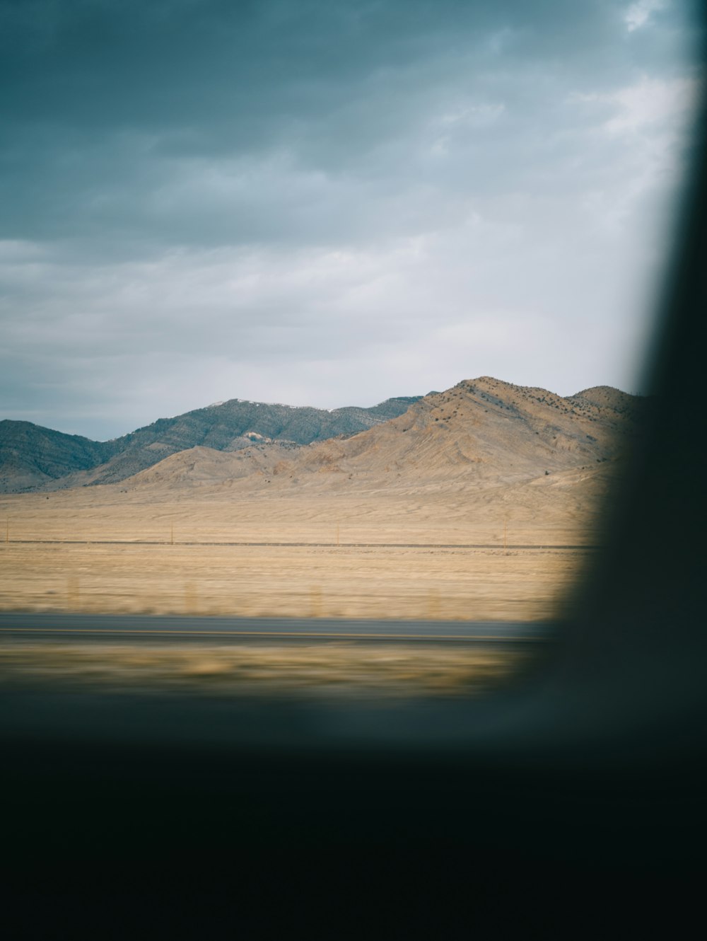 a view of mountains from an airplane window