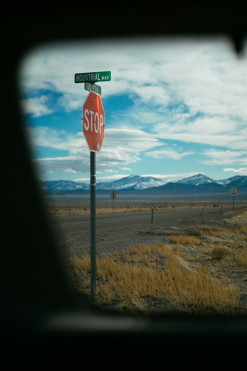 a stop sign with a street sign on top of it