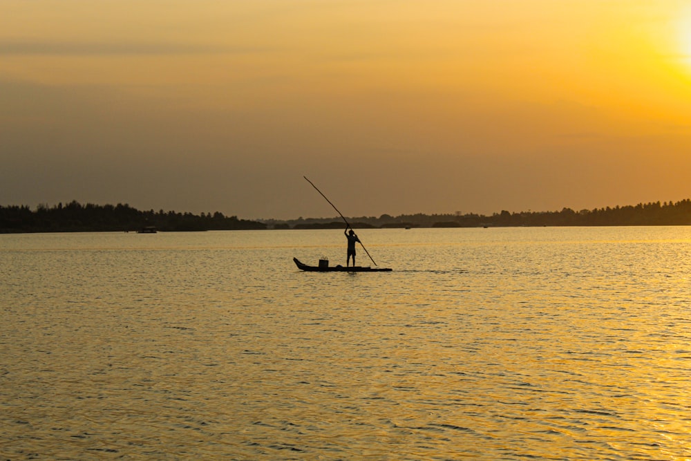 a person in a boat on a body of water