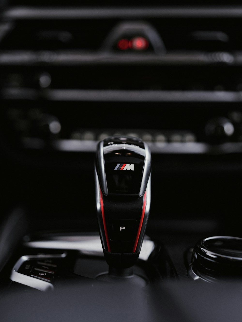 a close up of a remote control in a car