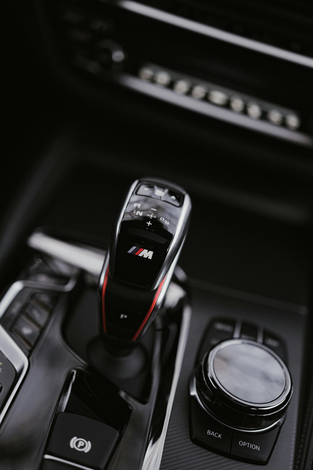 a close up of a remote control in a car