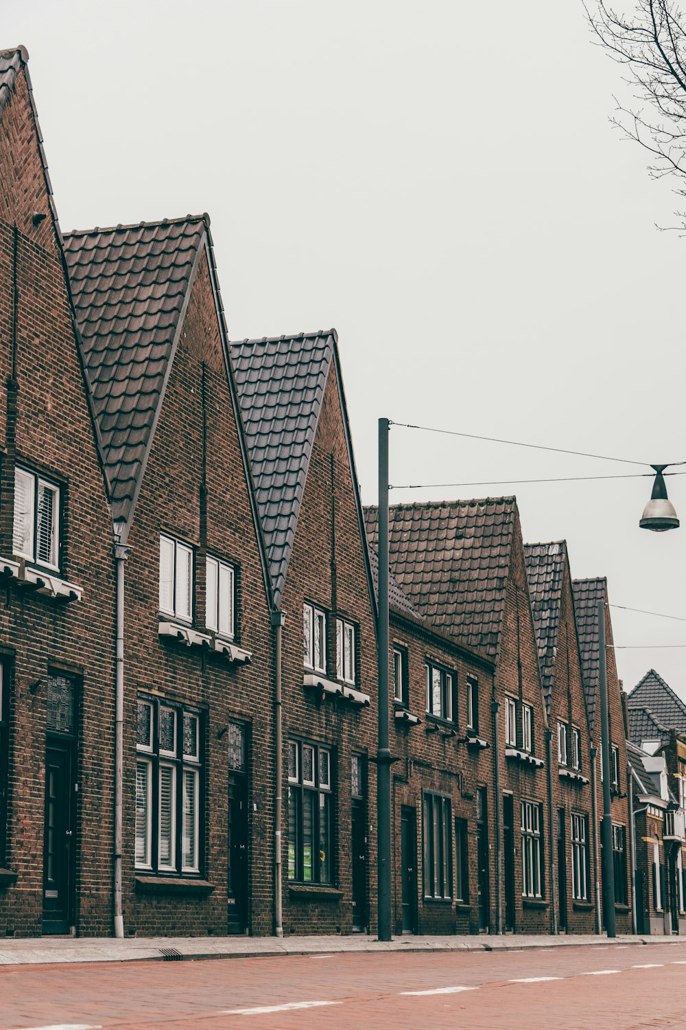 a row of brick houses on a street corner