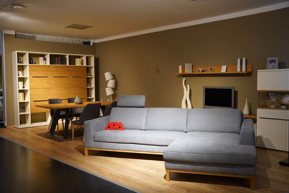 a living room filled with furniture and a flat screen tv