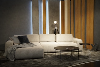 a living room with a white couch and a coffee table