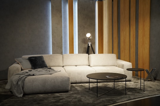 a living room with a white couch and a coffee table