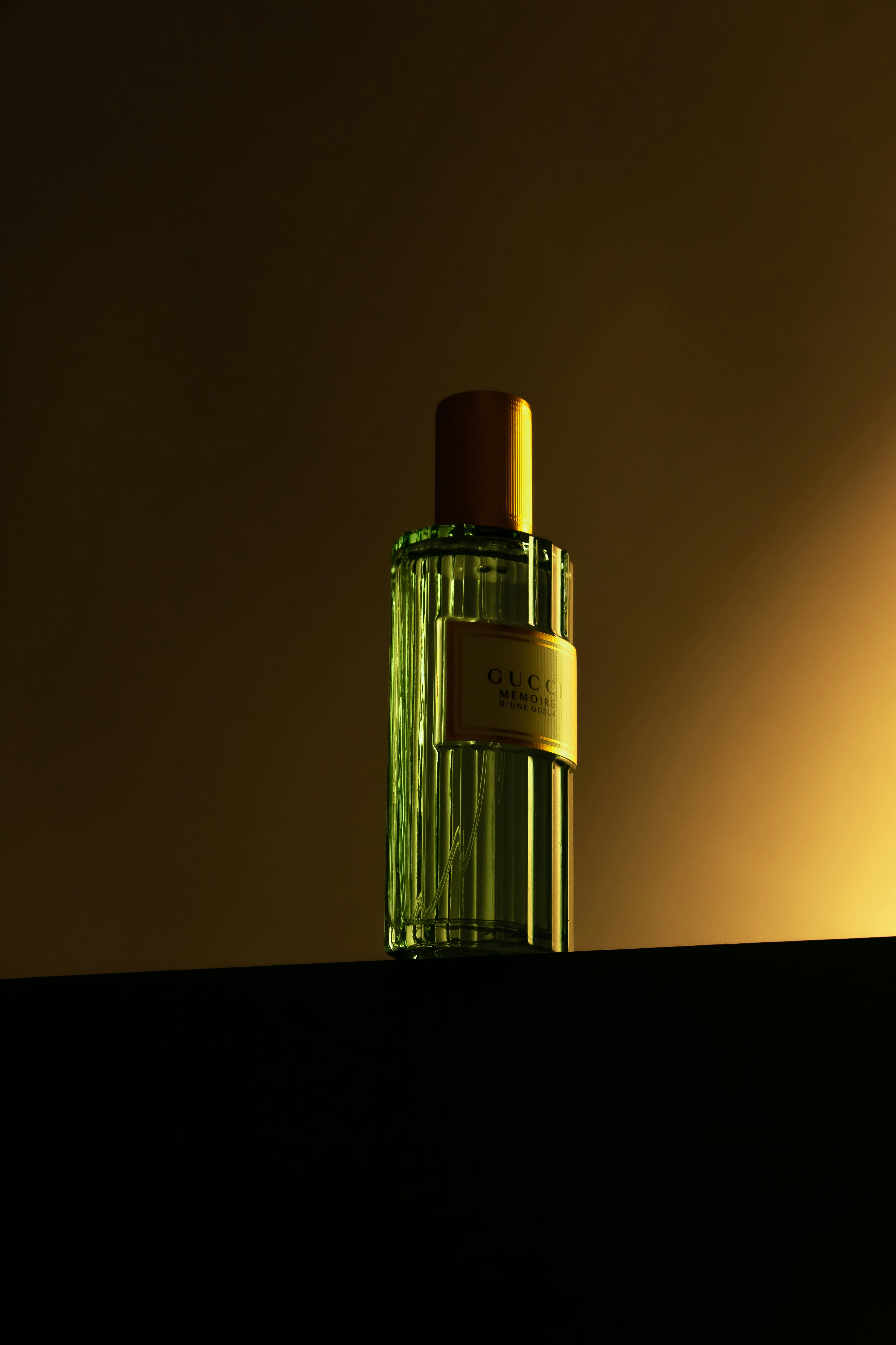 a bottle of perfume sitting on top of a shelf