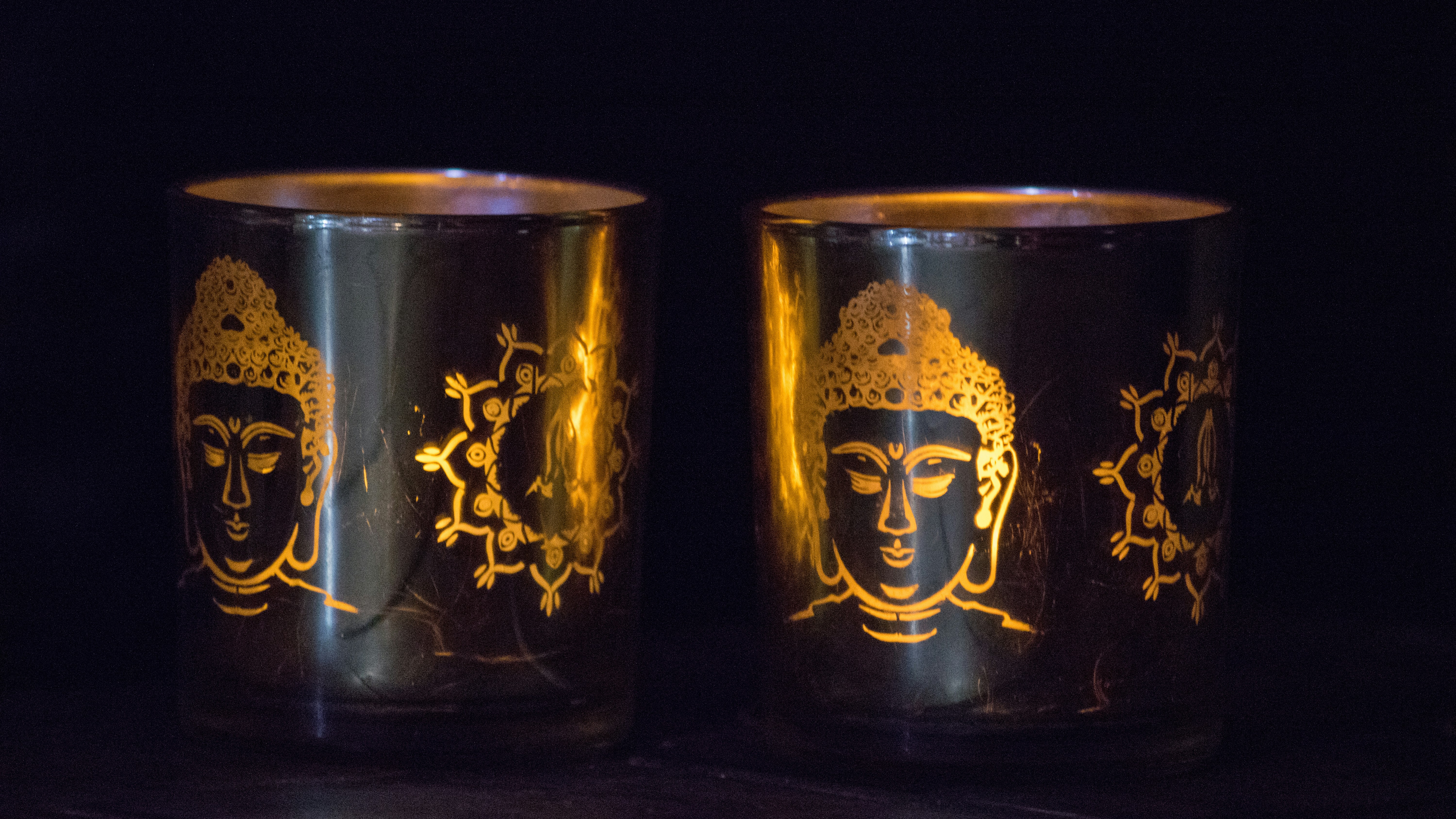 Golden ghee containers on table