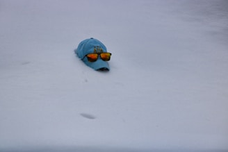 A stylish cap embroidered with a personalized name and colorful design, worn outdoors.