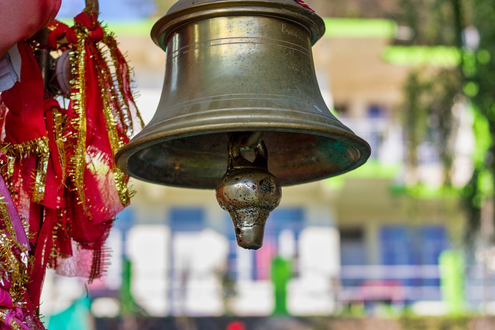 a close up of a bell on a pole