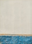 A textured wall with an upper portion painted in off-white and a lower portion in bright blue. The surface features visible brush strokes and signs of weathering. The separation between the colors is distinctly marked, suggesting a boundary between different materials or finishes.