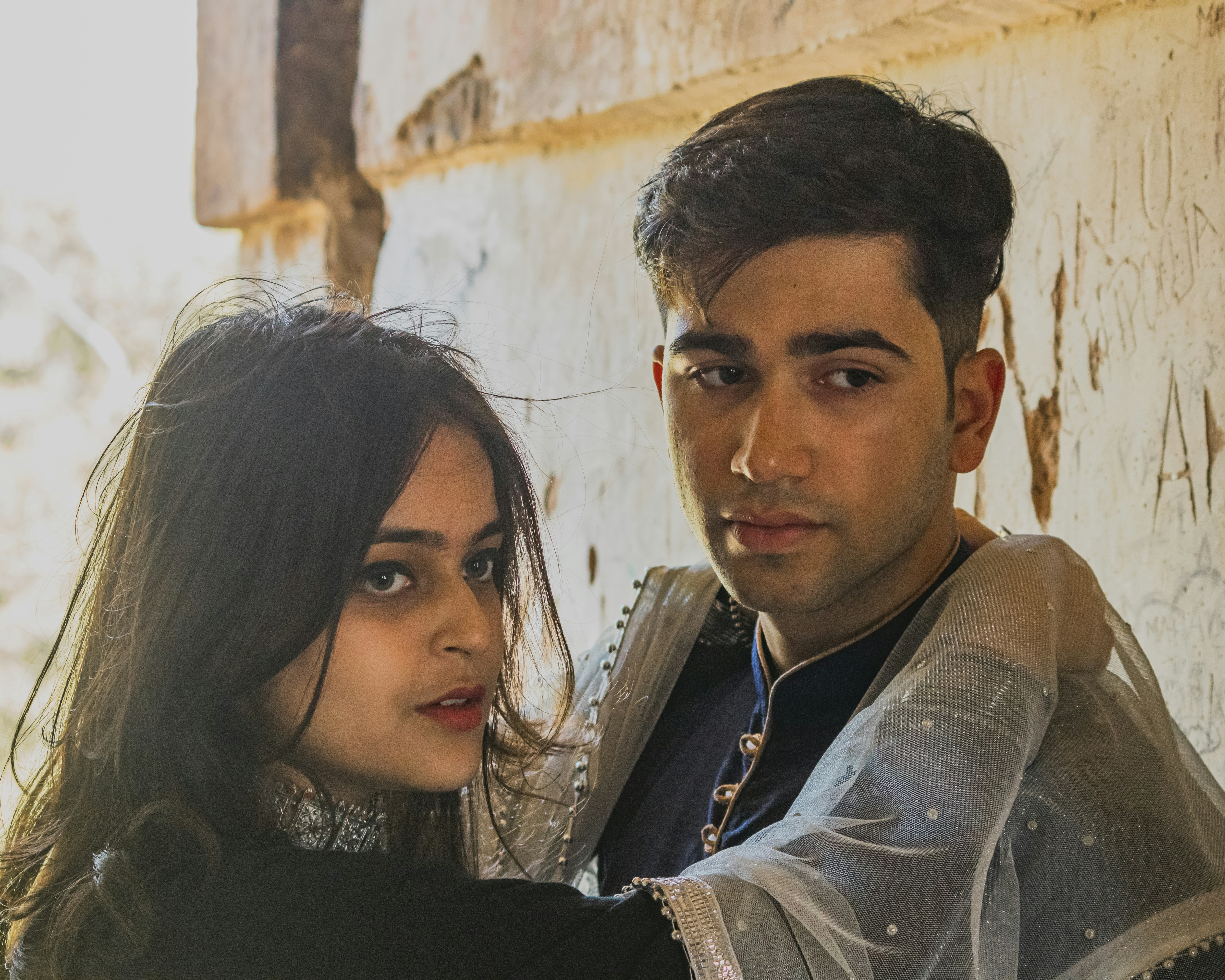 a man and a woman standing next to each other