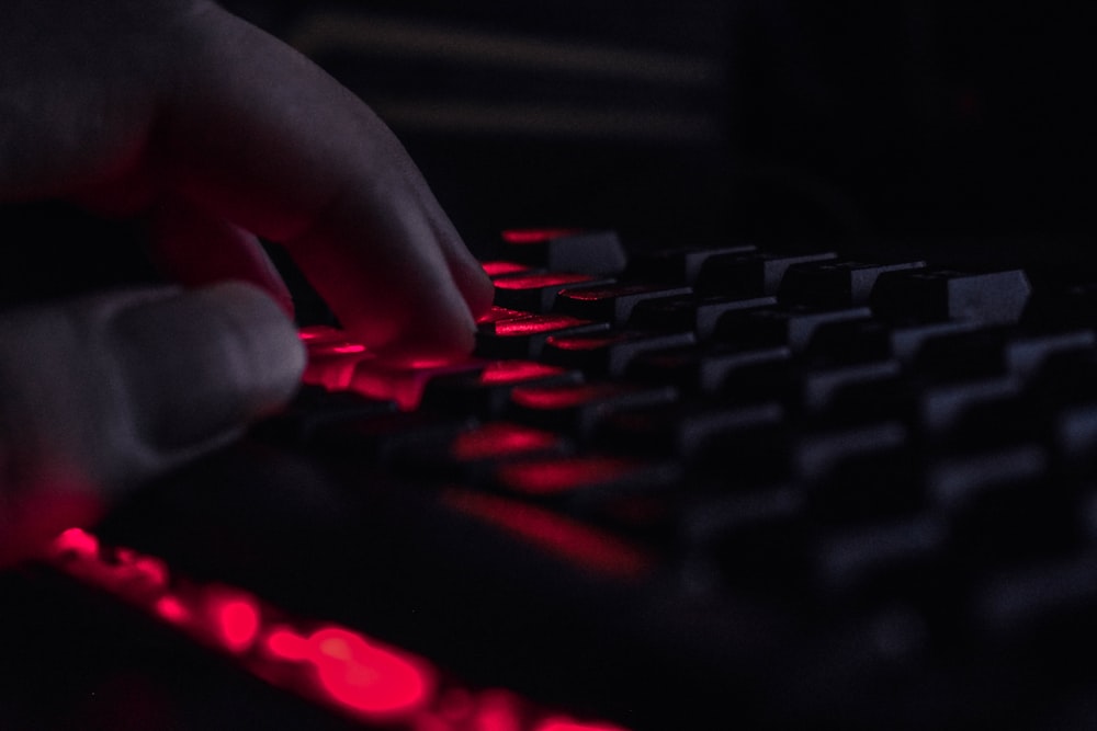a close up of a person's hand on a keyboard