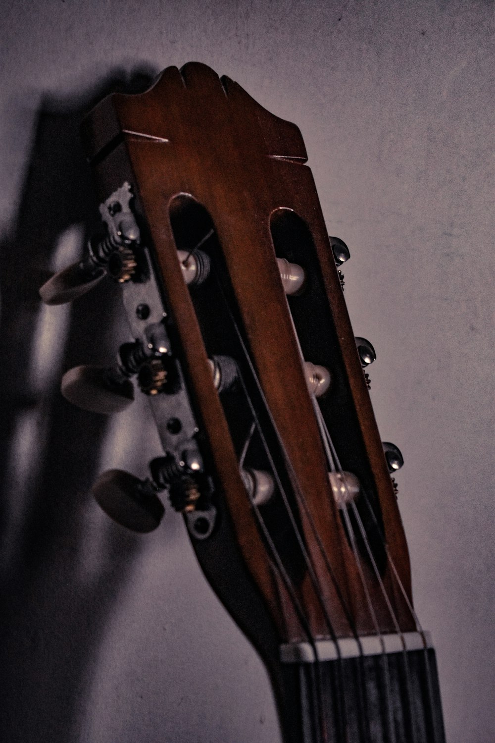 a close up of an acoustic guitar neck