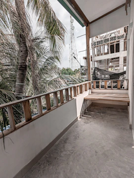 Completed balcony safety net installation overlooking a busy street in Navi Mumbai.