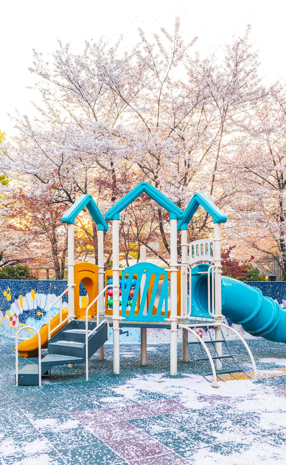 a children's play area with a slide and slide