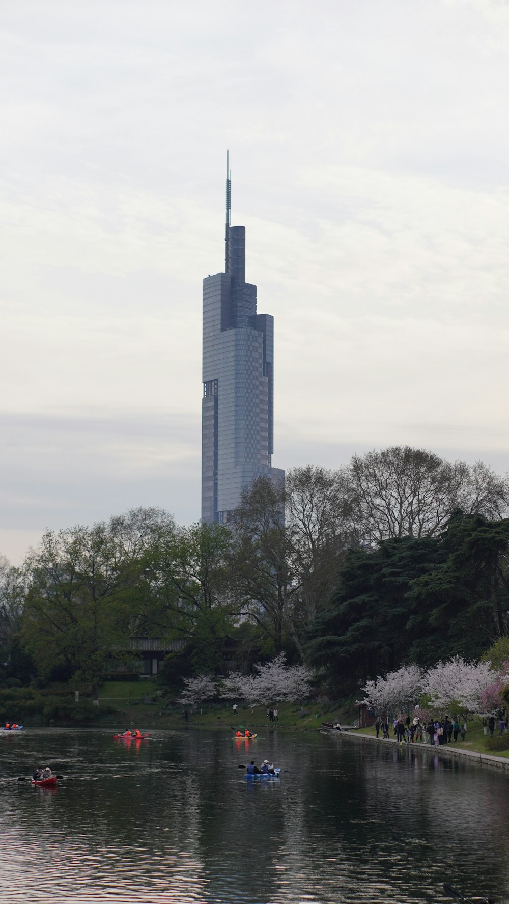 a large tall building towering over a body of water