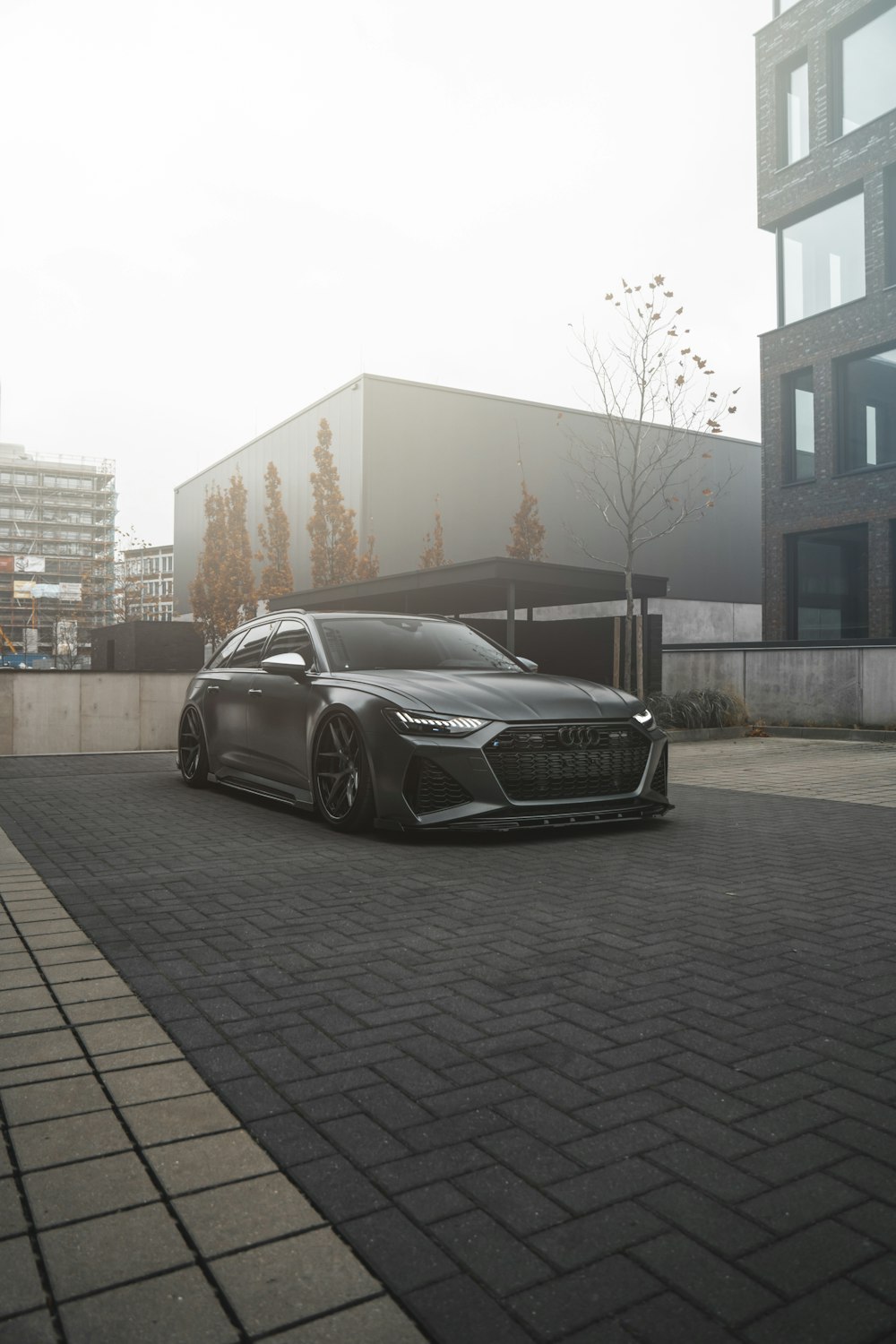 a black car parked in front of a building