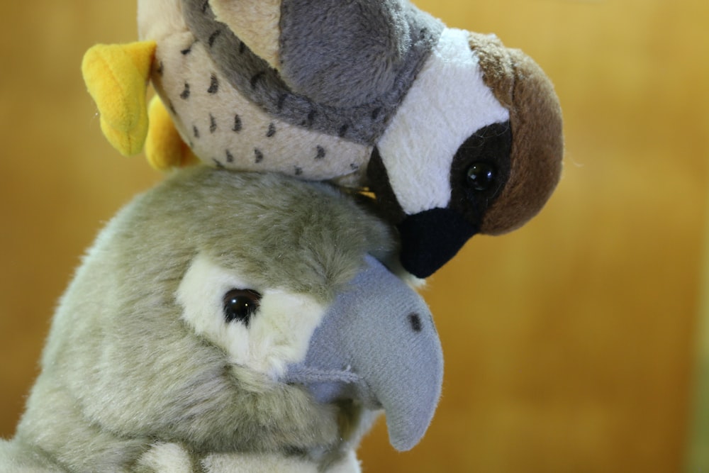 a stuffed bird and a stuffed bird on top of each other