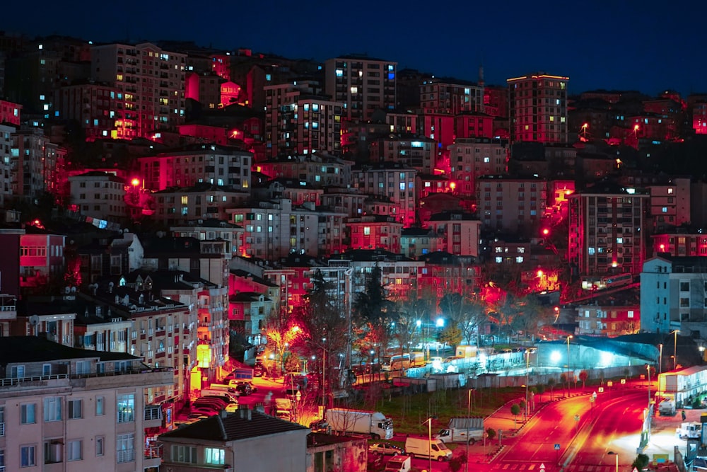a city at night lit up with red lights