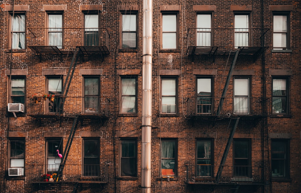 a tall brick building with lots of windows