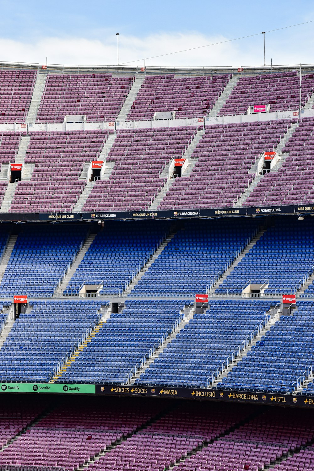 a stadium filled with lots of purple and blue seats