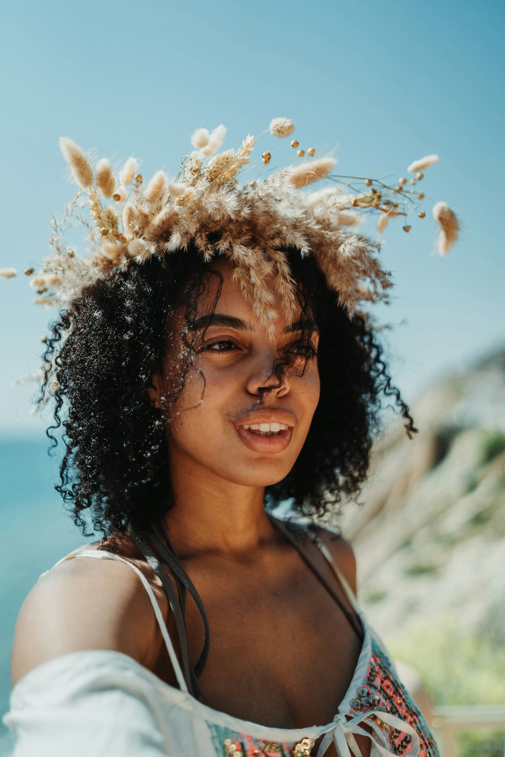 a woman with a flower crown on her head