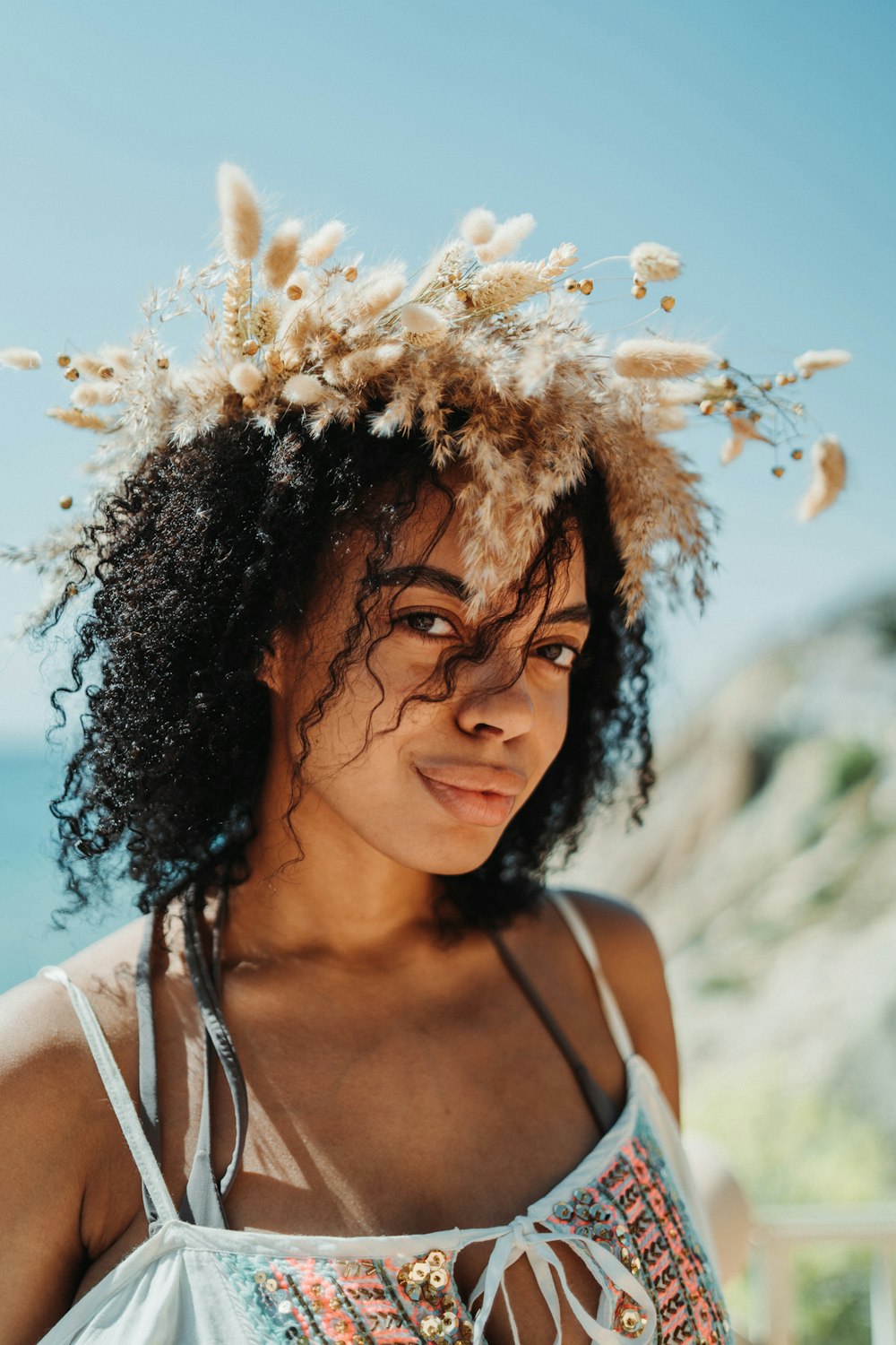 a woman with a flower crown on her head