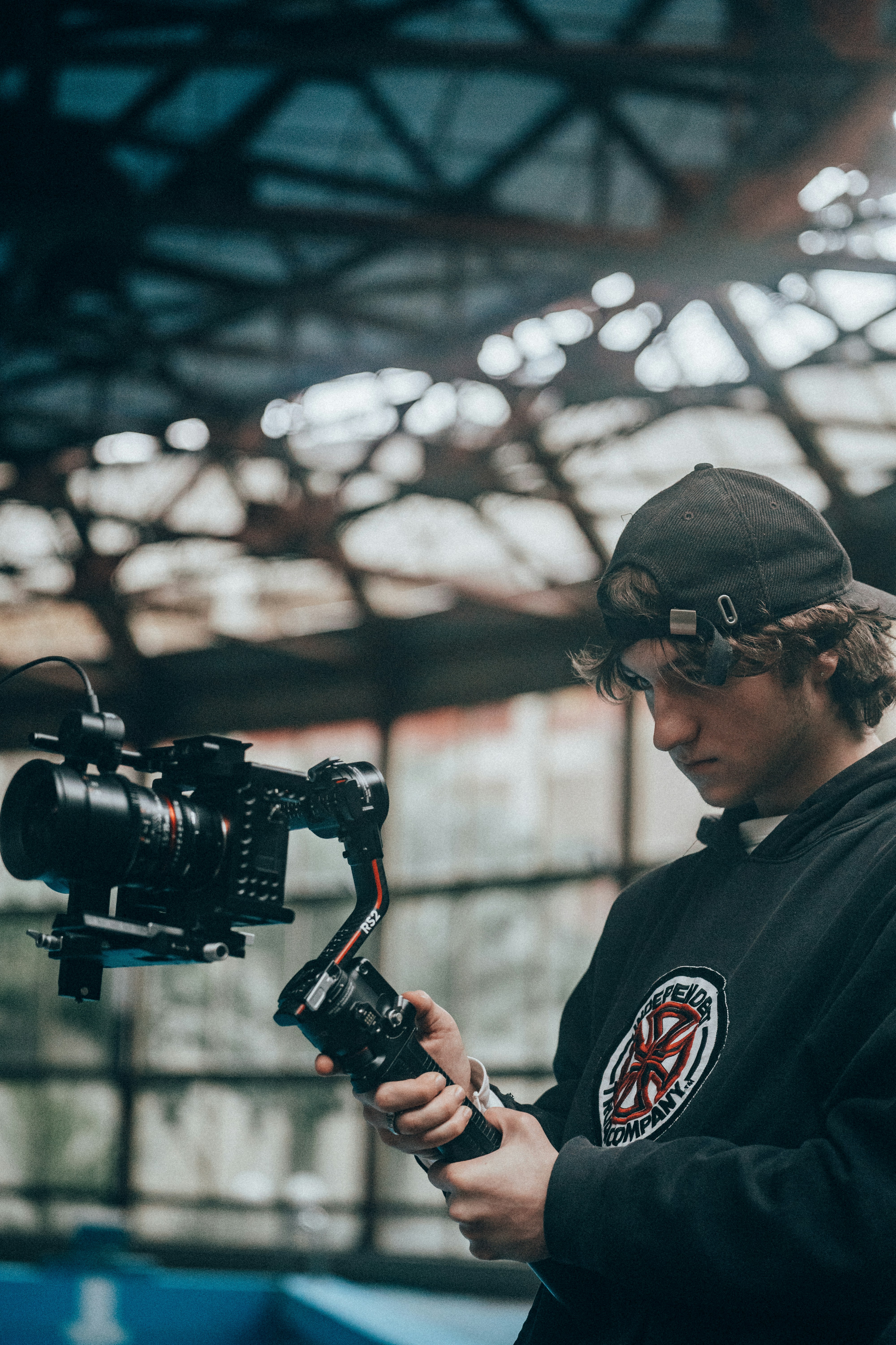 a man holding a camera and recording something