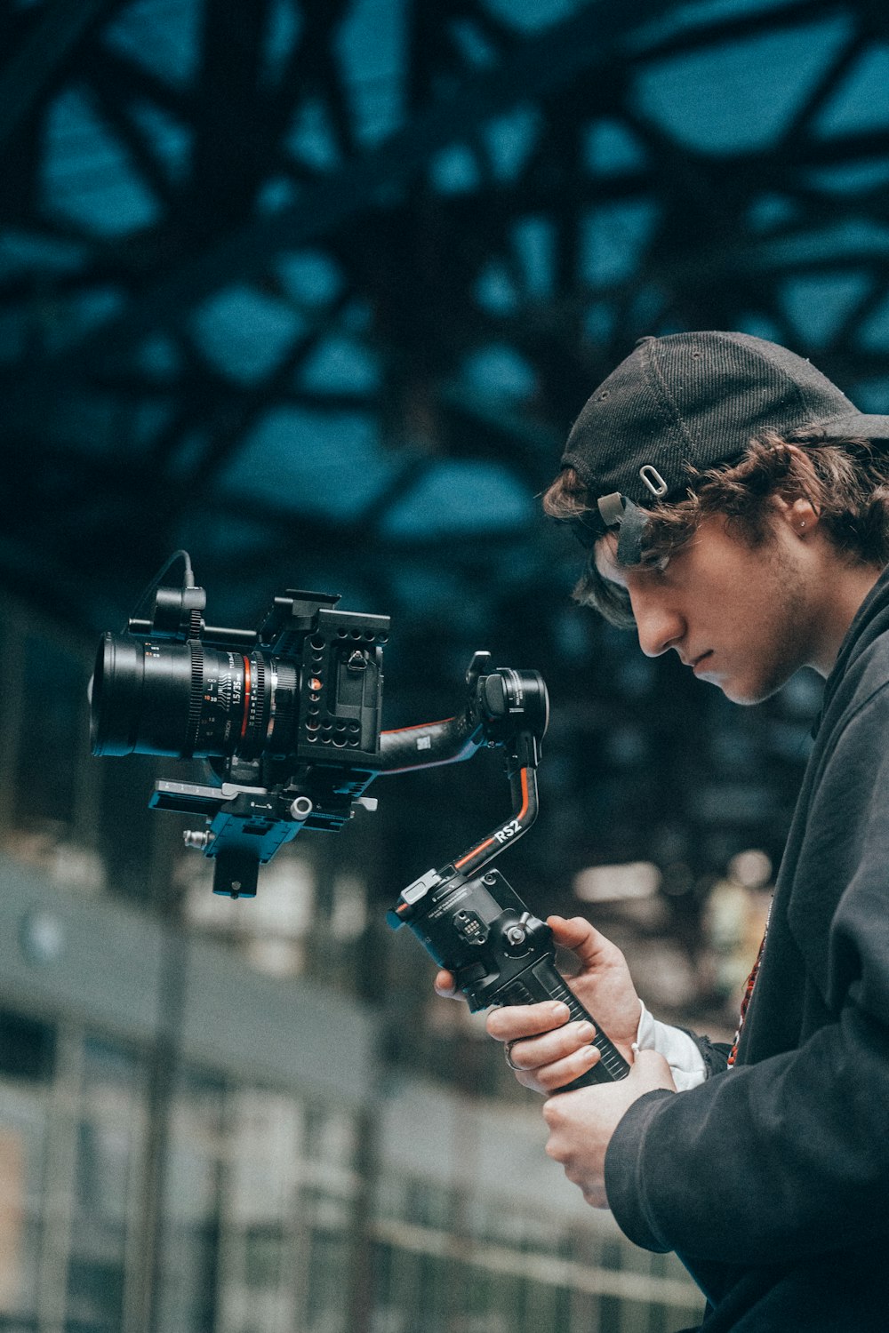 a man holding a camera and recording something