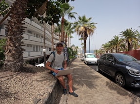 A friendly technician arriving at a Florida home with a laptop bag.