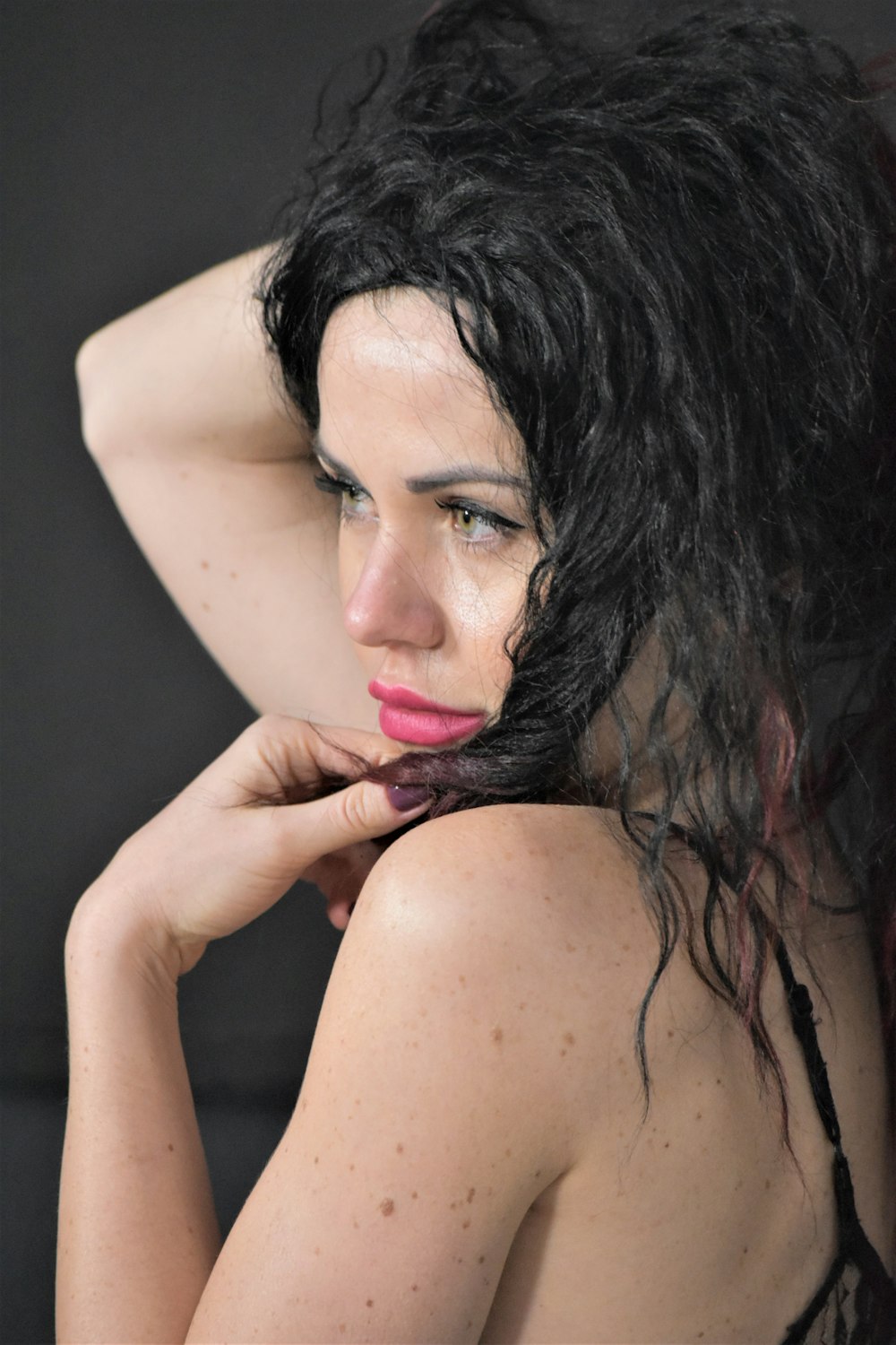 a close up of a woman with wet hair