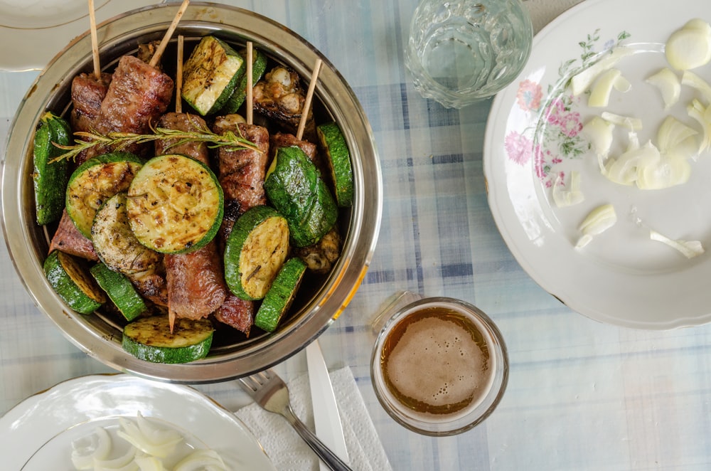 a pan filled with meat and vegetables on a table