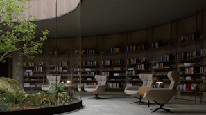 A serene library space with curved bookshelves filled with books, surrounding a central green atrium featuring a rock formation and small plants. Comfortable, modern armchairs with side tables are arranged around the atrium, inviting relaxation and reading.