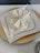 A stylish table setting featuring plates from Topchoice Industries.