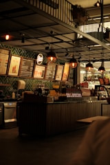 Interior view of Cafe Capsule with sleek capsule coffee machines and cozy seating.