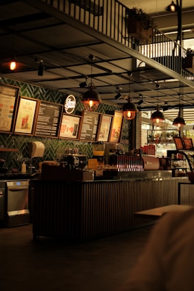Interior view of Cafe Capsule with sleek capsule coffee machines and cozy seating.