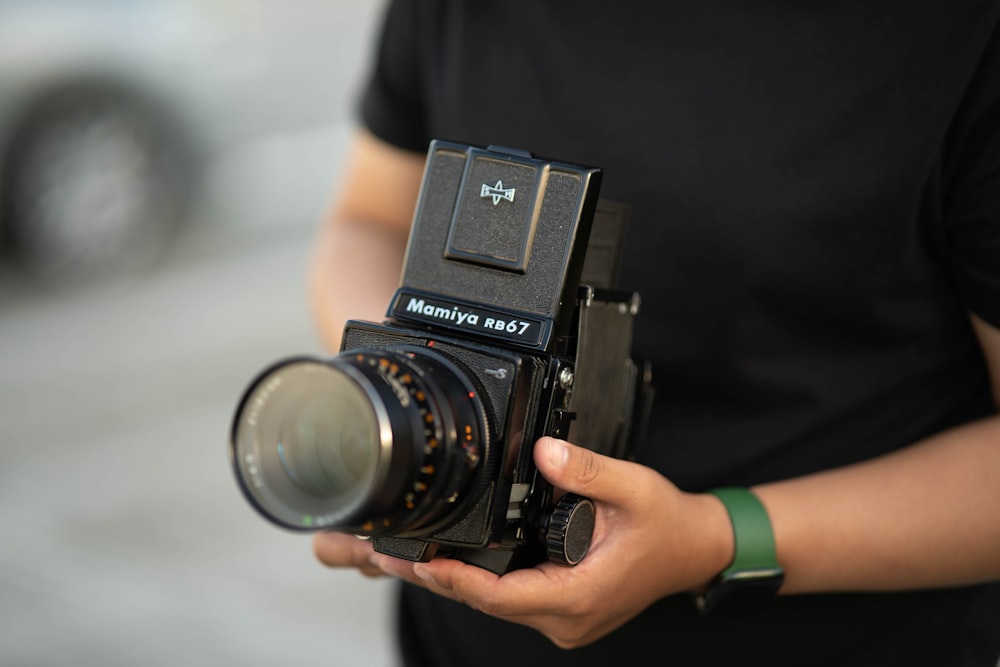 a person holding a camera in their hands