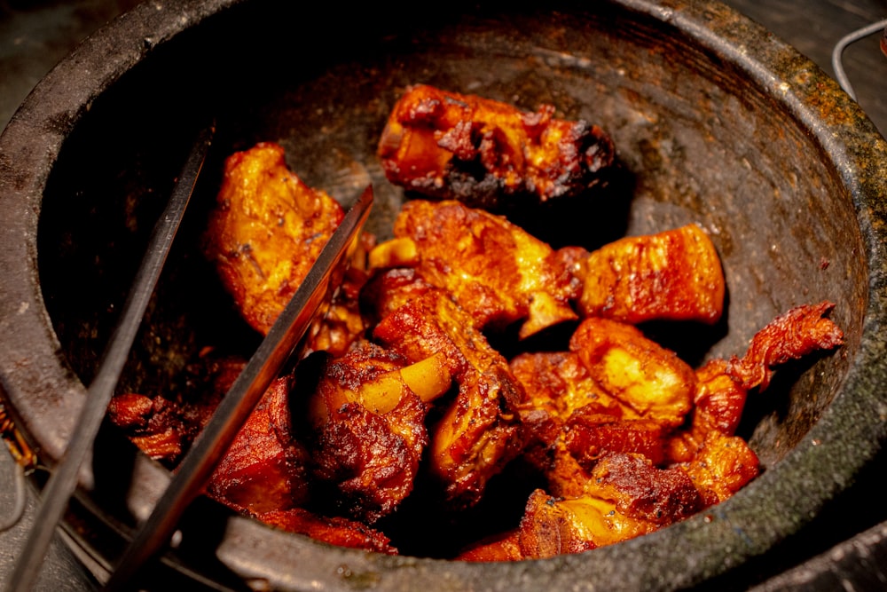 a close up of a bowl of food with a spoon