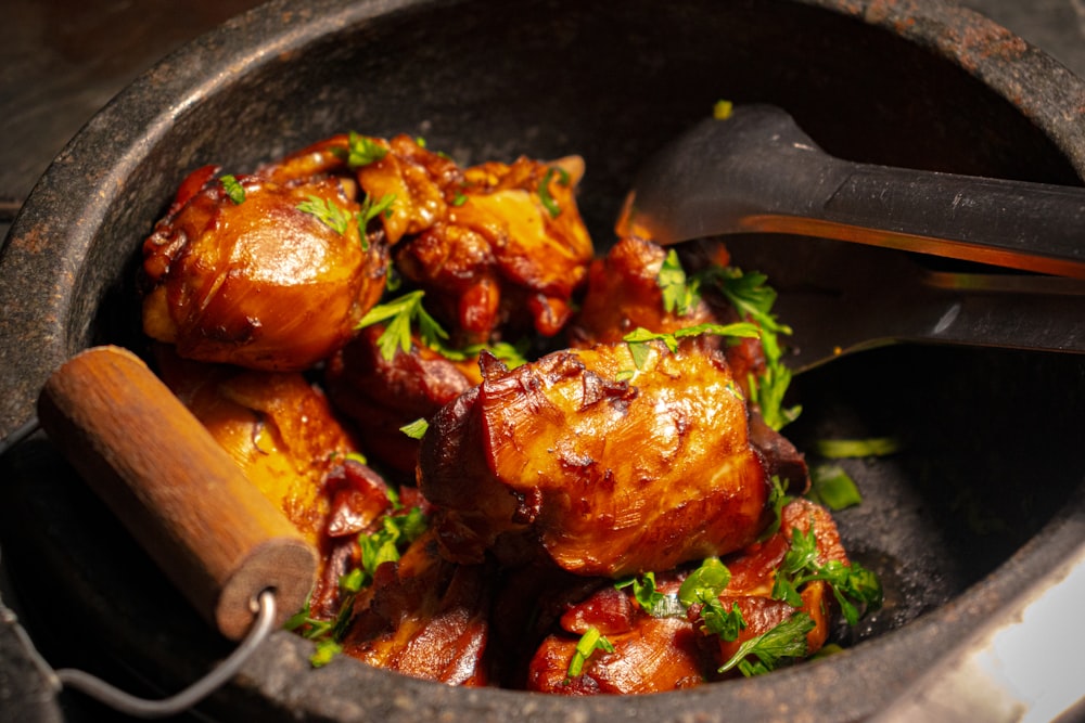 a close up of a bowl of food with a spoon