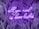 A neon sign with the phrase 'all you need is love lashes' in cursive is displayed against a dark backdrop of stylized palm leaves. The neon light emits a bright purple glow that contrasts with the darker background, creating a vibrant and eye-catching effect.