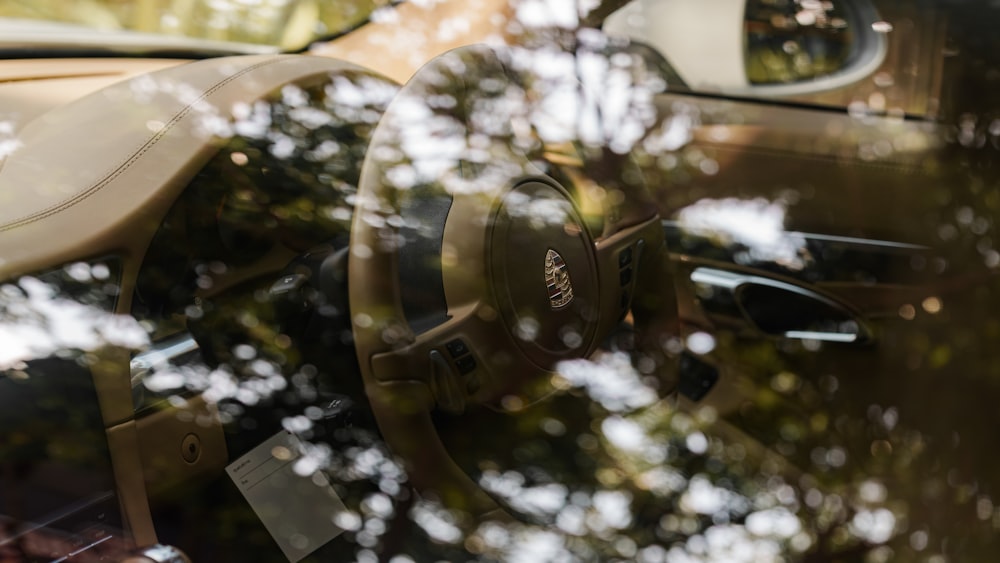 a close up of a steering wheel and dashboard of a car