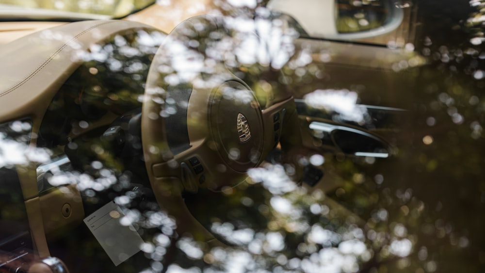 a close up of a steering wheel and dashboard of a car