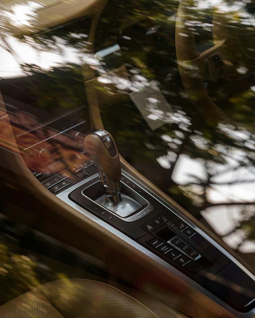 a car dashboard with a steering wheel and a dash board