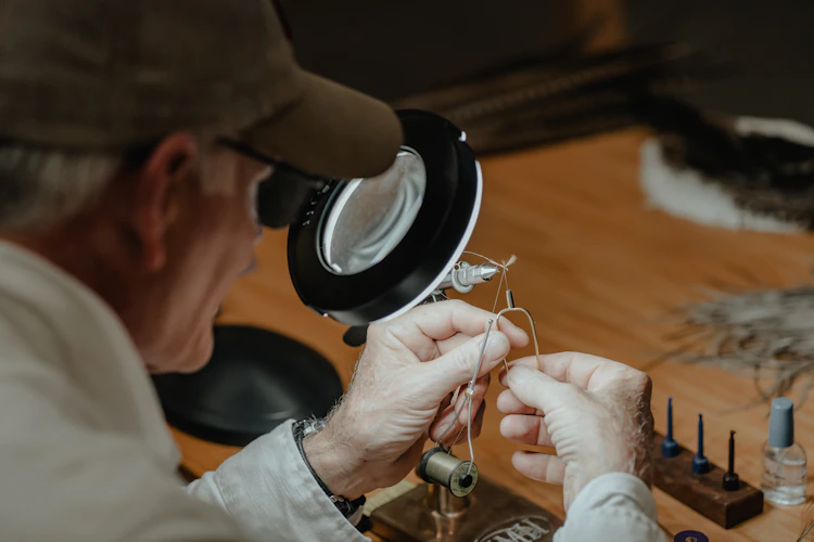 tying flies at the bench