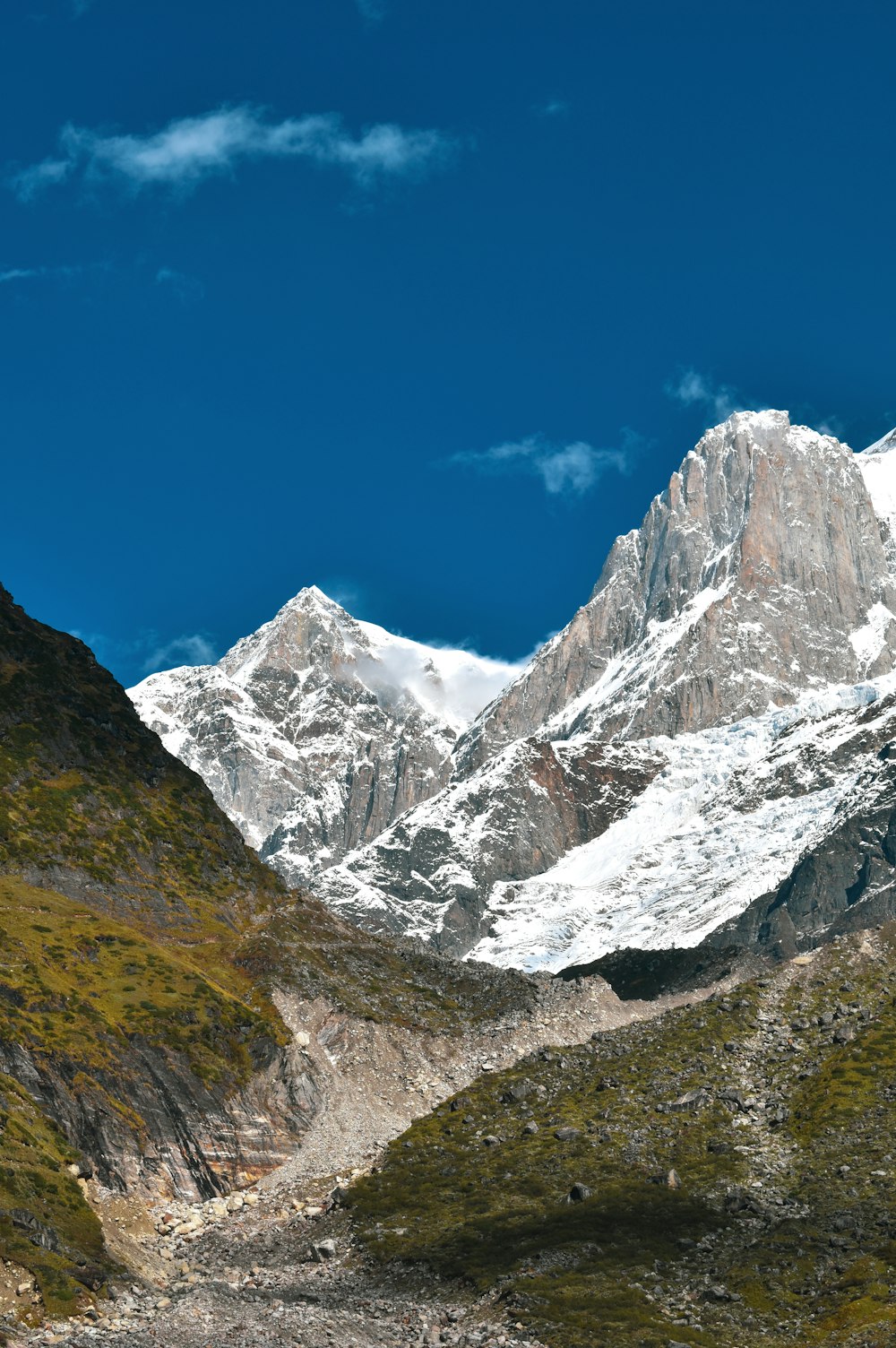 a view of a mountain range with snow on it