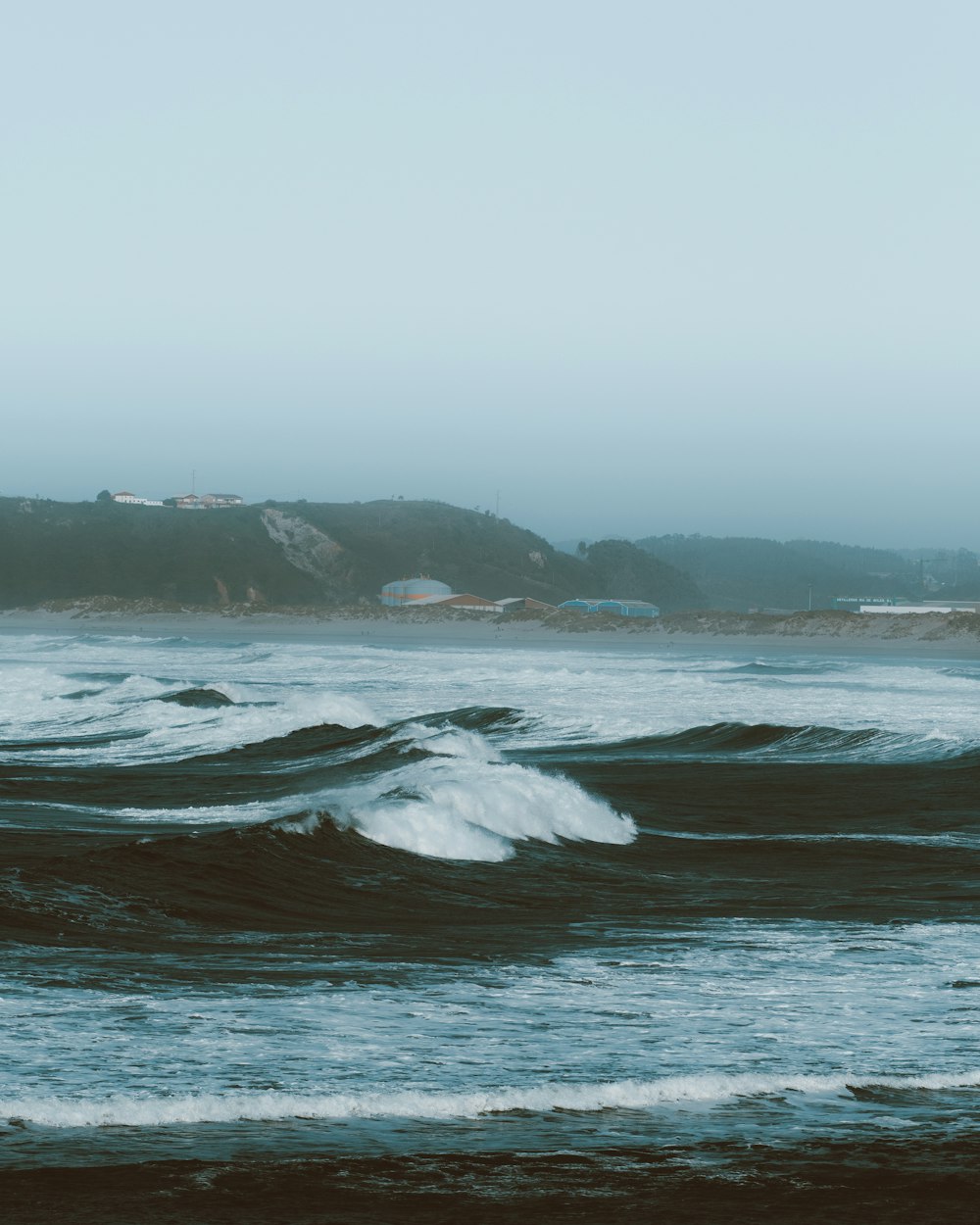 a person riding a surfboard on a wave in the ocean